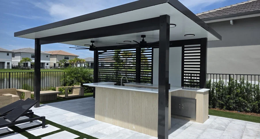 Modern covered outdoor kitchen with a service counter and shaded seating